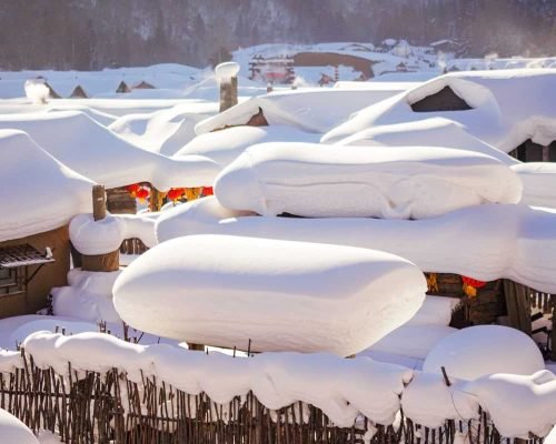 A town near Harbin called Snow Town, with wooden houses topped with a thick pack snow.